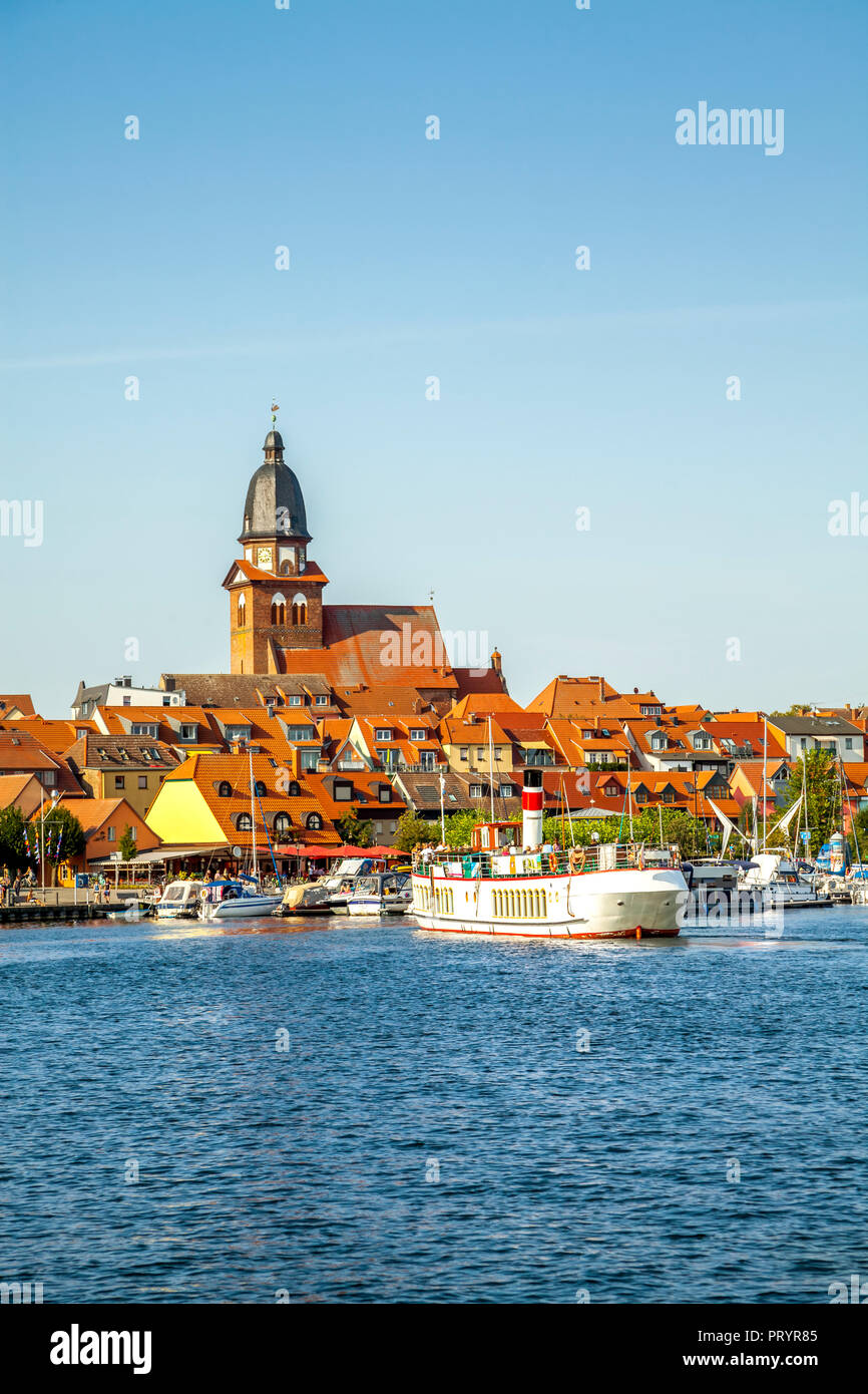 Germany, Mecklenburg-Western Pomerania, Waren an der Mueritz, Old town, tourboat at harbour Stock Photo