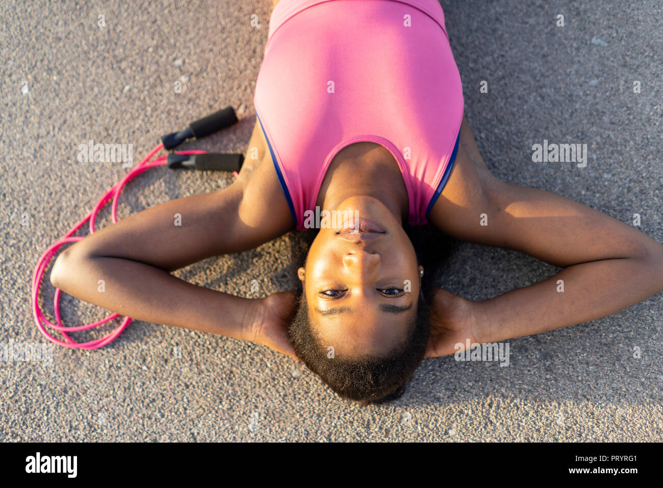 Young woman lying concrete floor hi res stock photography and