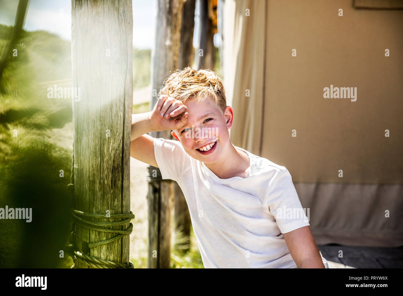Portrait of happy boy on campsite Stock Photo