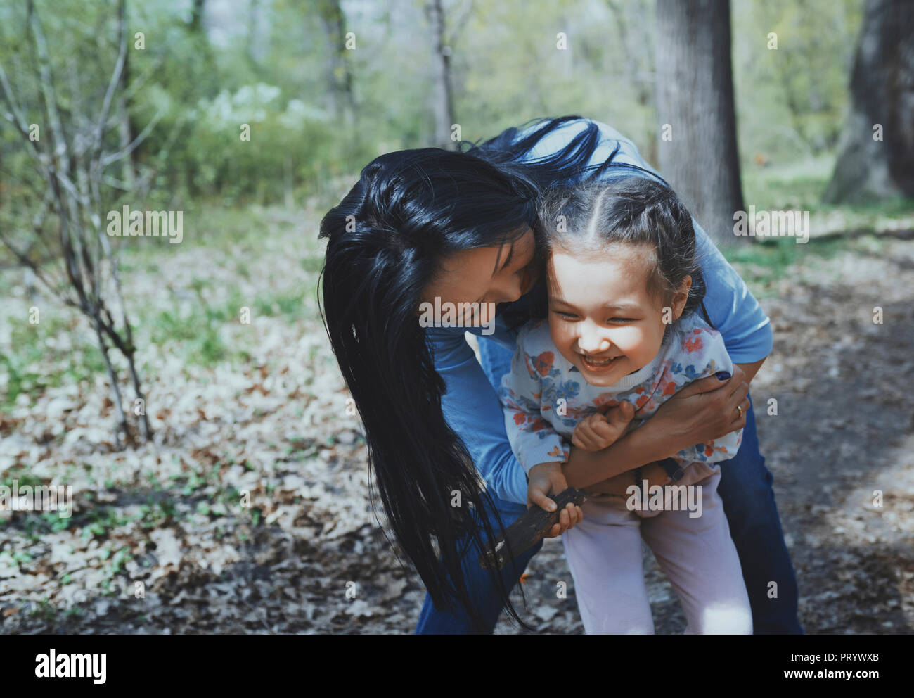Mother and daughter having fun in a park Stock Photo - Alamy