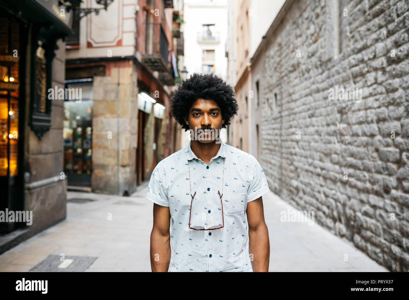 Spain, Barcelona, portrait of man with moustache and curly hair Stock Photo