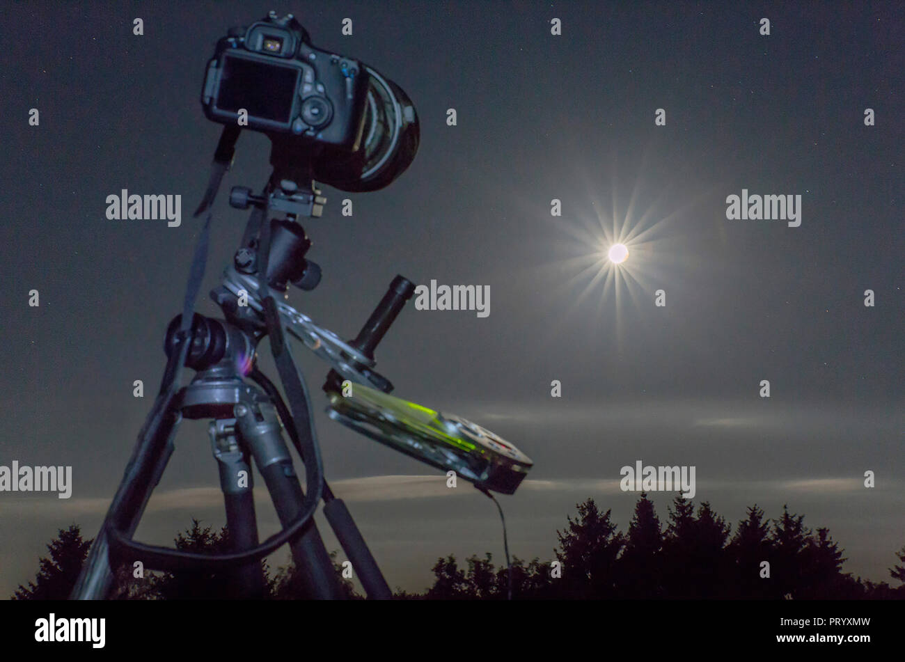 Germany, Hesse, Hochtaunuskreis, Equipment used for astro photography, photographing a full moon eclipse Stock Photo