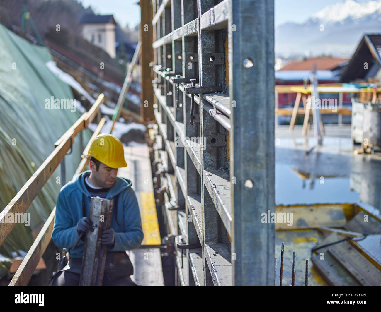 Construction worker working on plywood Stock Photo
