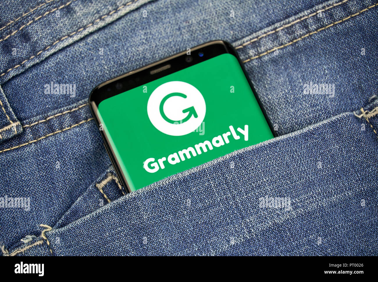 MONTREAL, CANADA - OCTOBER 4, 2018: Grammarly check logo and app on a Samsung s8 screen. Grammarly is a popular English-language writing-enhancement s Stock Photo