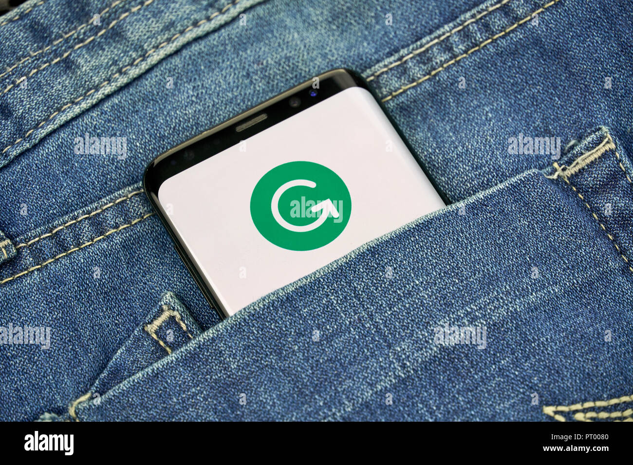 MONTREAL, CANADA - OCTOBER 4, 2018: Grammarly check logo and app on a Samsung s8 screen. Grammarly is a popular English-language writing-enhancement s Stock Photo