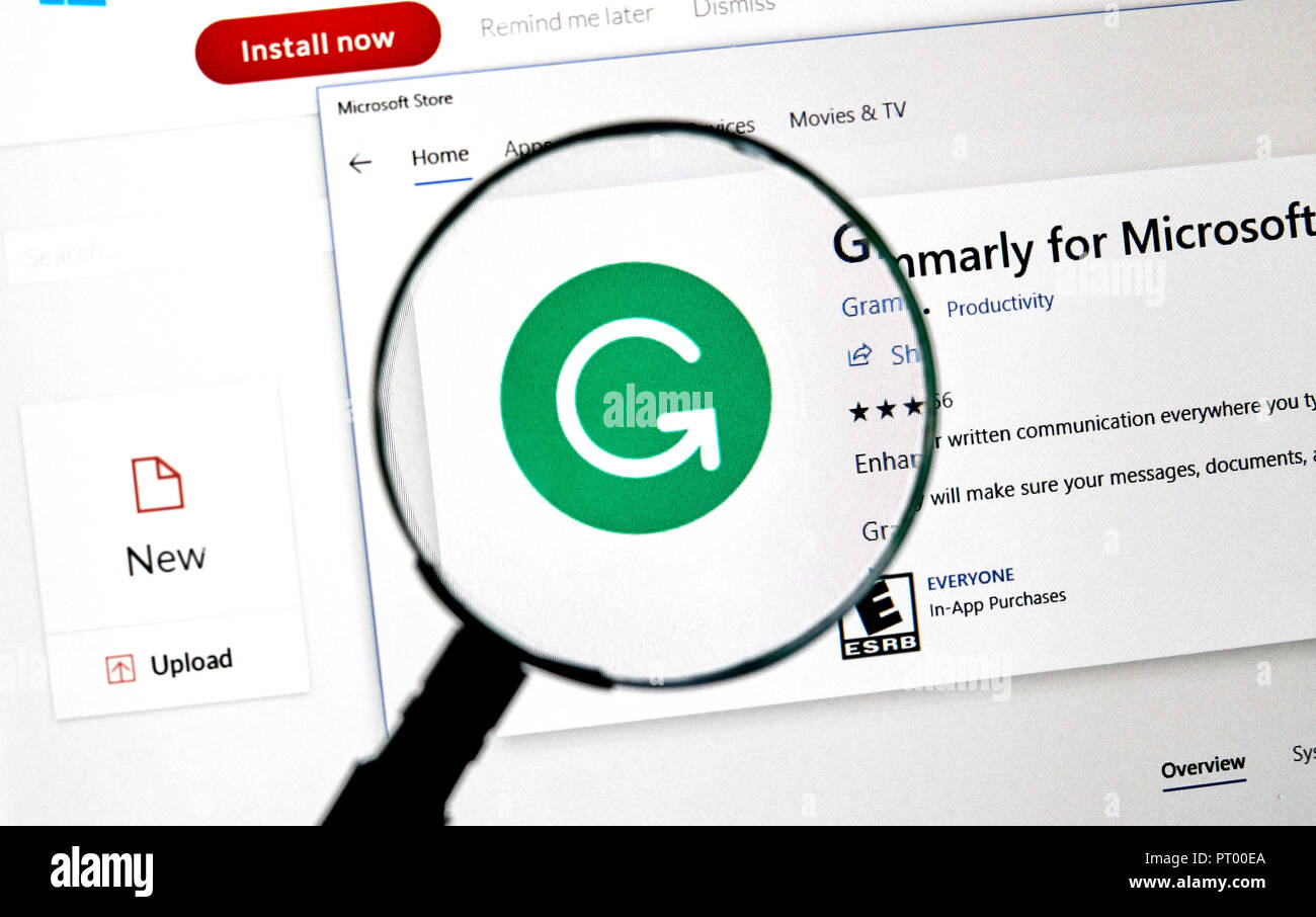 MONTREAL, CANADA - OCTOBER 4, 2018: Grammarly check web page on a PC screen under magnifying glass. Grammarly is a popular English-language writing-en Stock Photo