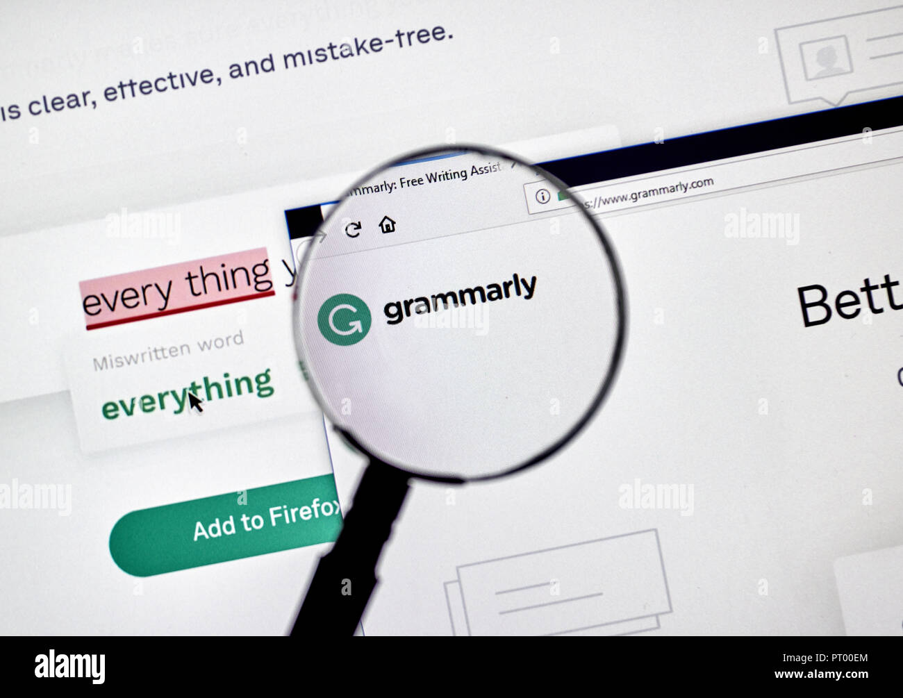 MONTREAL, CANADA - OCTOBER 4, 2018: Grammarly check web page on a PC screen under magnifying glass. Grammarly is a popular English-language writing-en Stock Photo