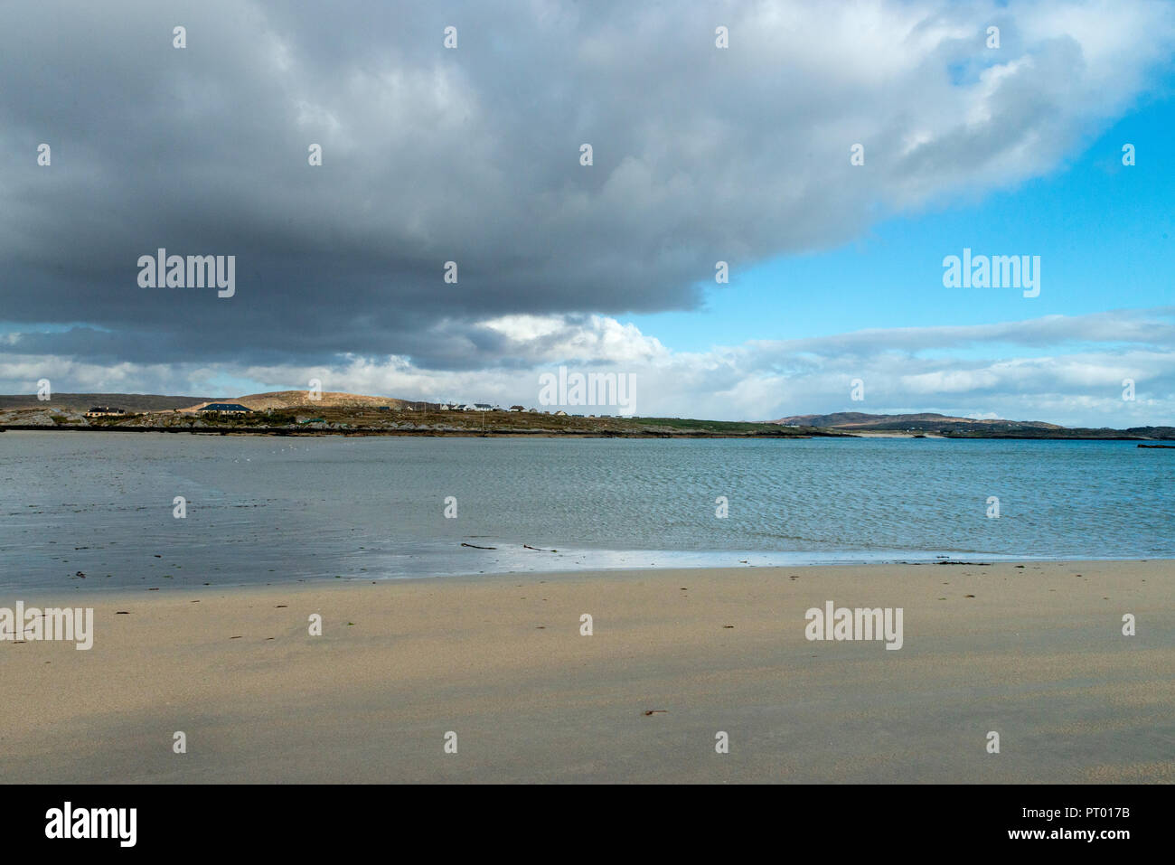 Europe, Ireland,  Connemara, Omey Island , It is possible to drive or walk across a large sandy strand to the island by following the arrowed signs. Stock Photo