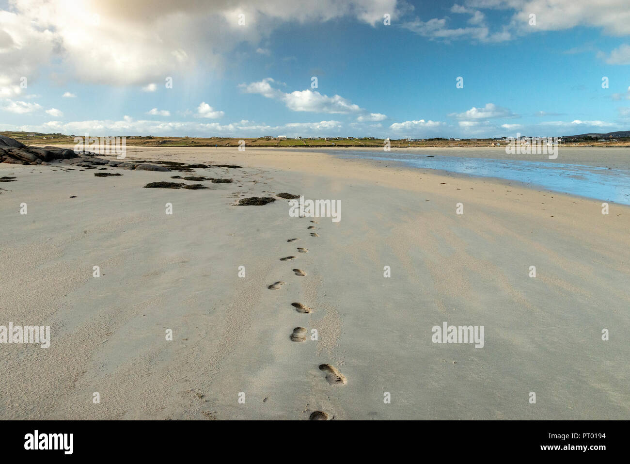 Europe, Ireland,  Connemara, Omey Island , It is possible to drive or walk across a large sandy strand to the island by following the arrowed signs. Stock Photo