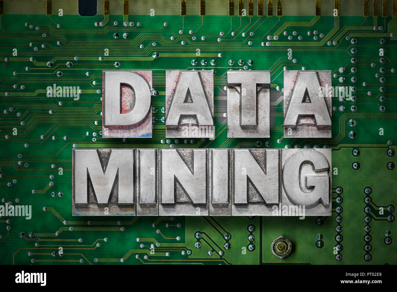 data mining phrase made from metallic letterpress blocks on the pc board background Stock Photo
