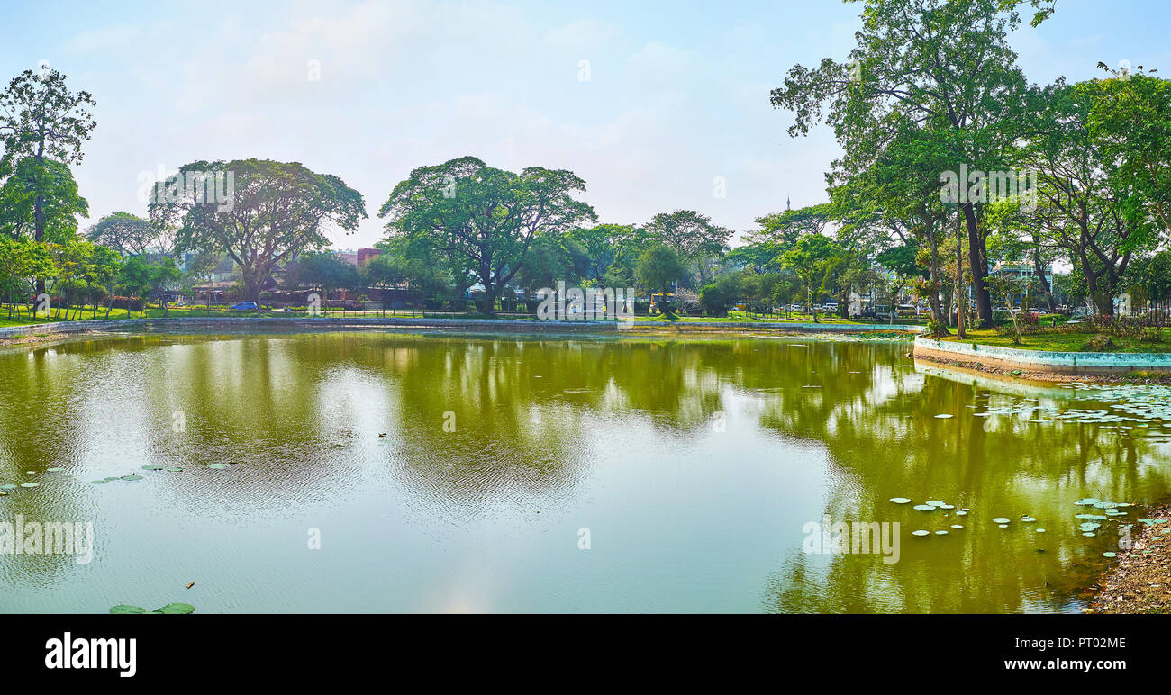 The scenic and quiet Kandawgyi Nature Park is the best place to relax in shade of trees and enjoy the sites in heart of busy and noisy city, Yangon, M Stock Photo