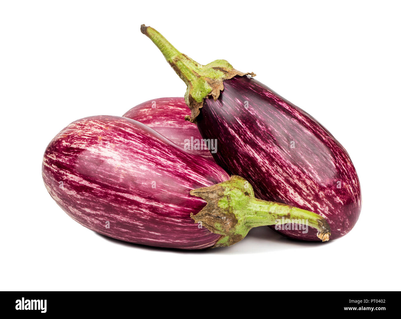 Three fresh purple eggplant graffiti on white background Stock Photo