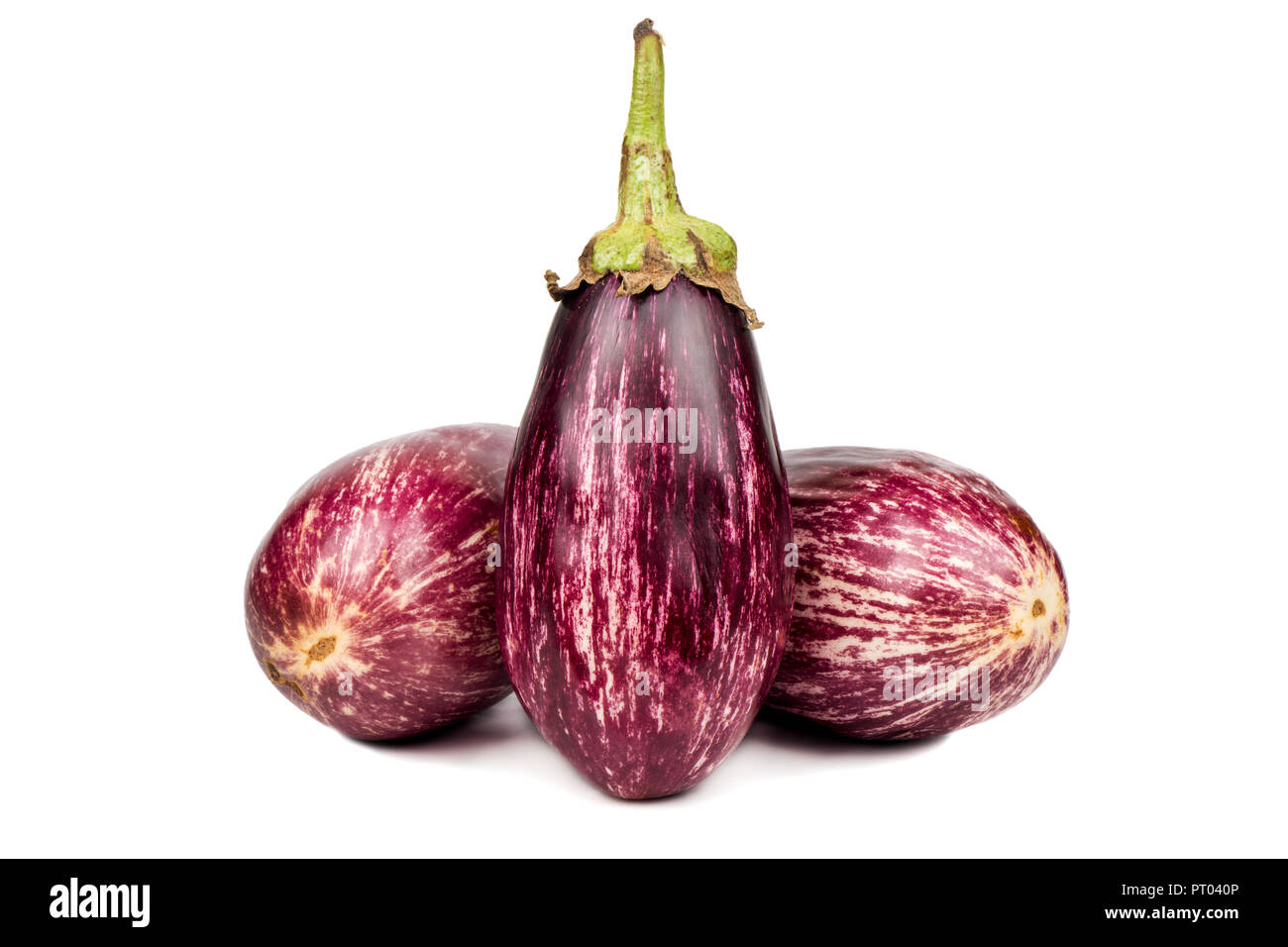 Three raw purple eggplant graffiti on white background Stock Photo