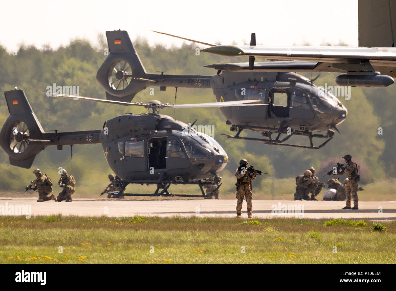 BERLIN, GERMANY - APR 27, 2018: German military Airbus H145M helicopters and special forces performing a military demonstration at the Berlin ILA Air  Stock Photo