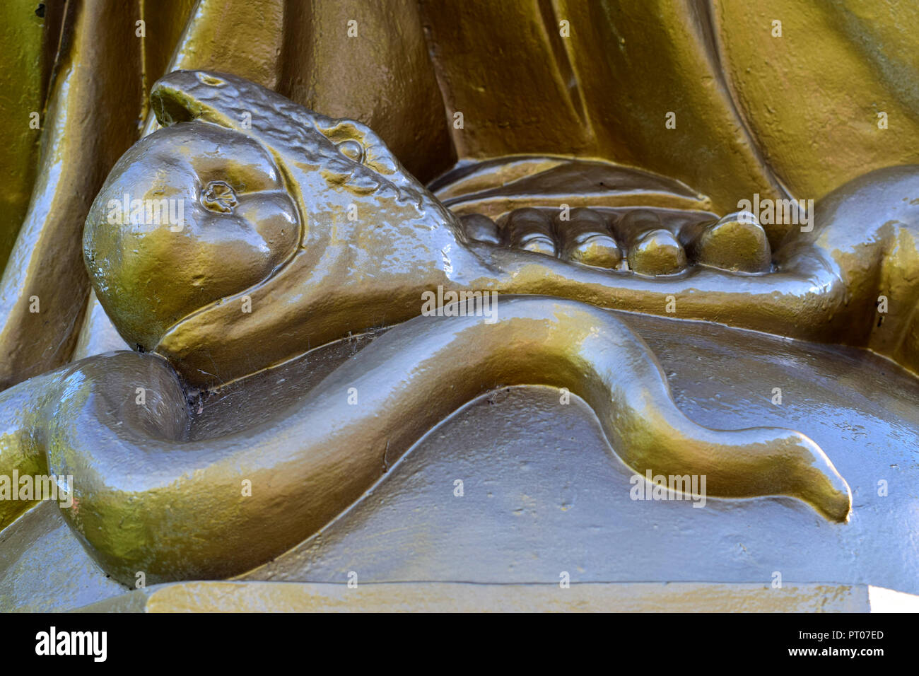 The serpent swallowing a fruit from the tree of knowledge. Section of a sculpture in St-Anne de Beaupré, Canada Stock Photo