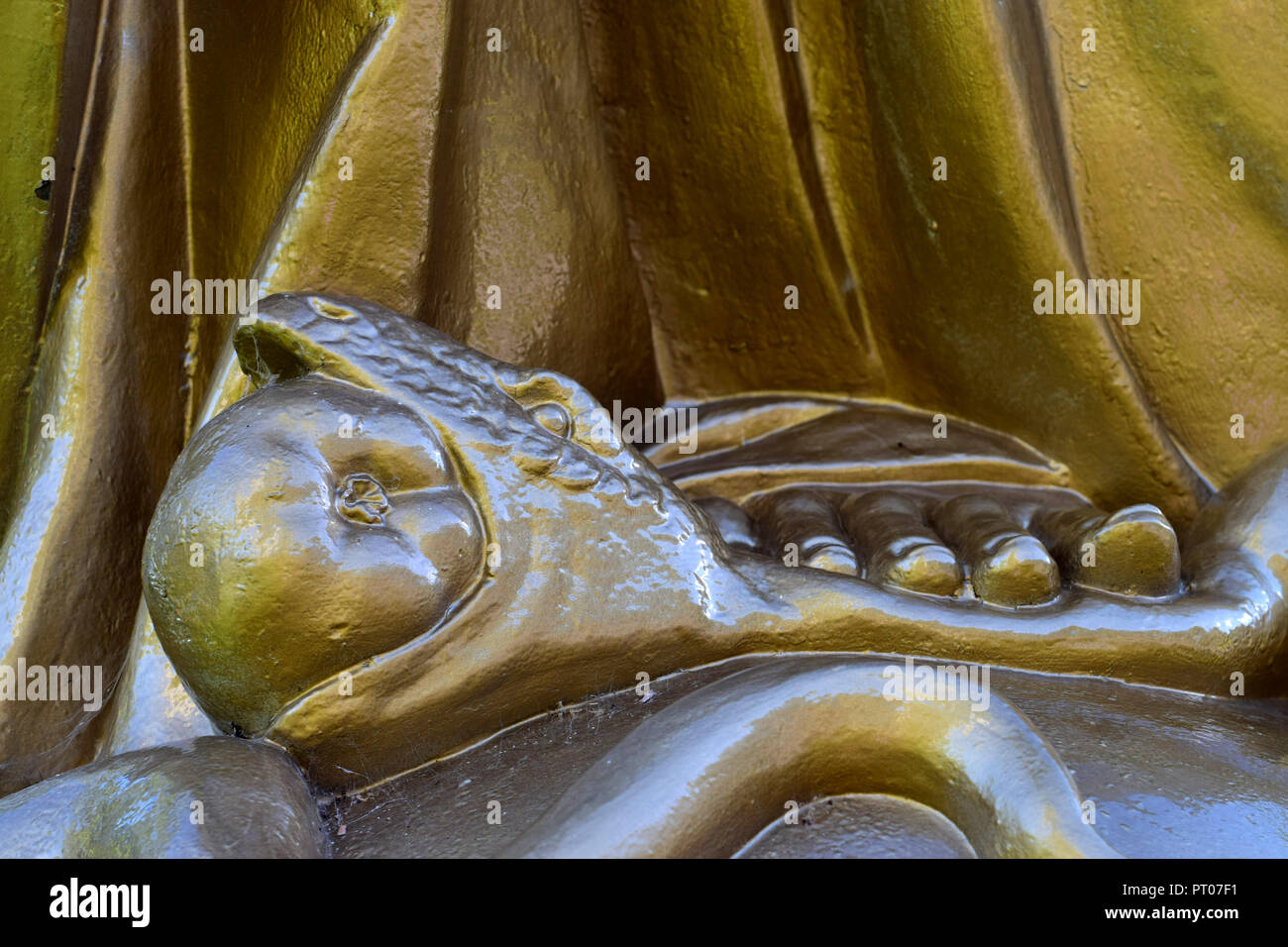 The serpent swallowing a fruit from the tree of knowledge. Section of a sculpture in St-Anne de Beaupré, Canada Stock Photo