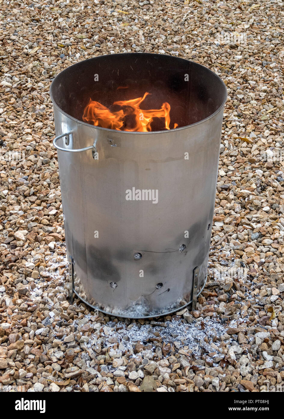 Burning garden waste and confidential waste papers in a garden