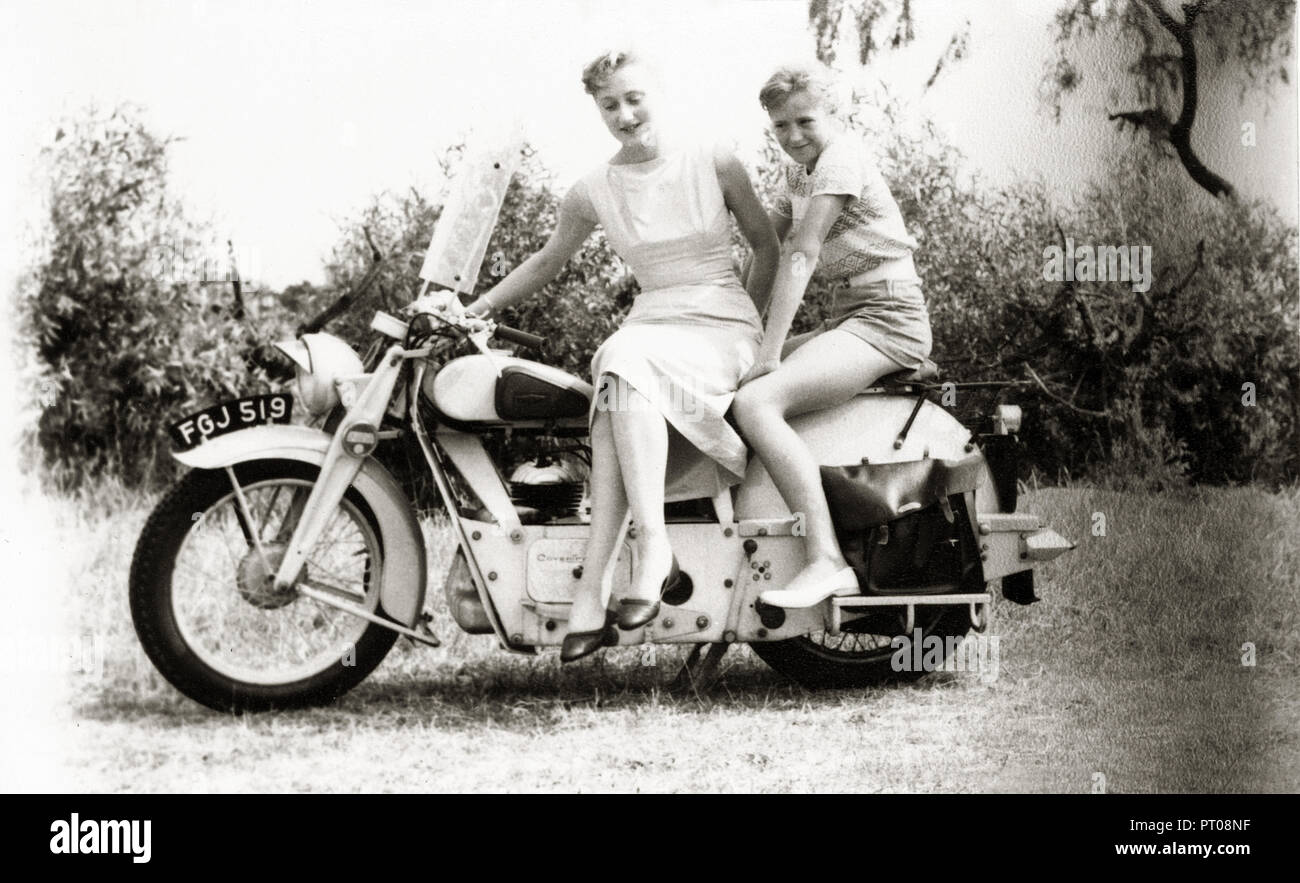 Lady & girl on veteran motorcycle circa late 1940s early 50s Stock Photo