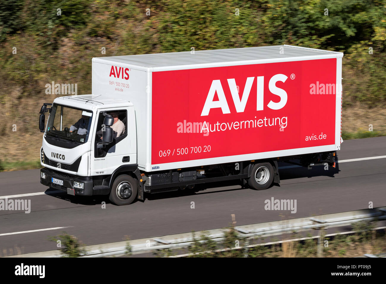 Iveco Eurocargo of Avis on motorway. Avis is an American car rental company headquartered in Parsippany, New Jersey, United States. Stock Photo