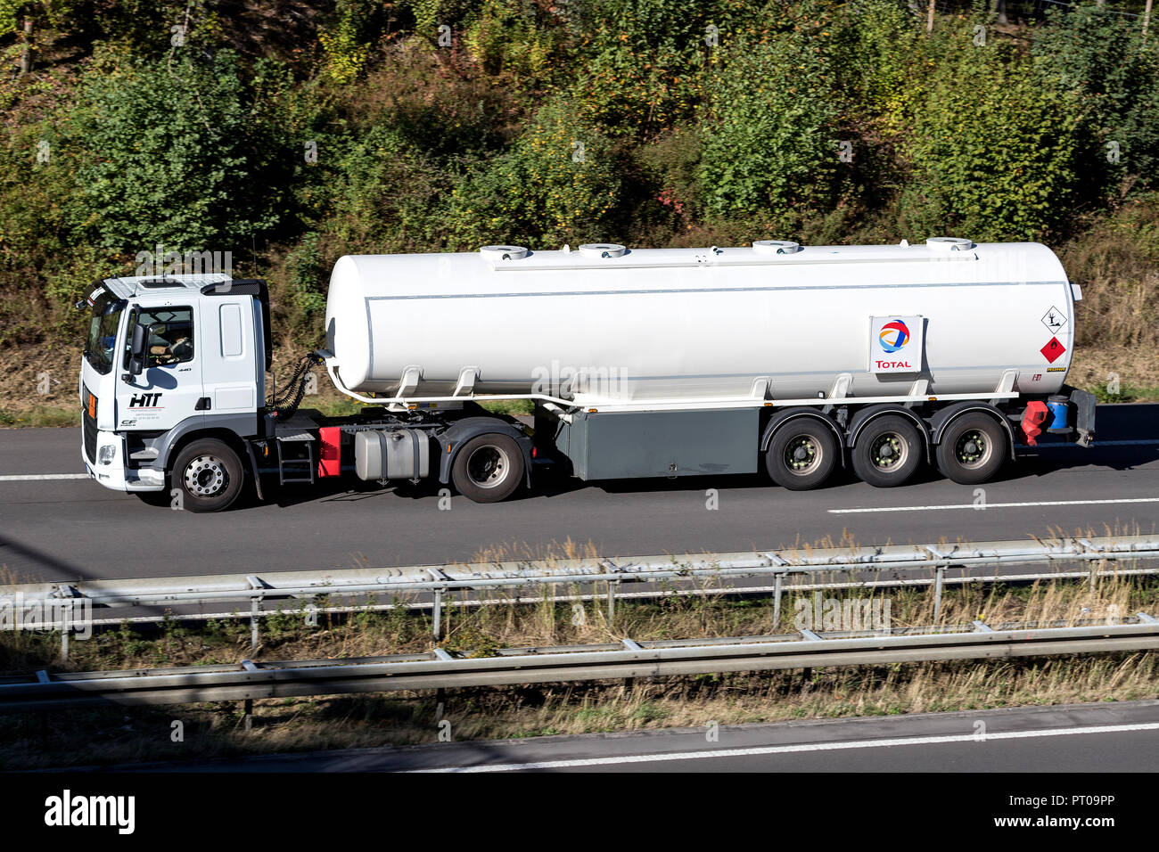 Total truck on motorway. Total s a French multinational integrated oil and gas company and one of the seven Supermajor oil companies in the world. Stock Photo