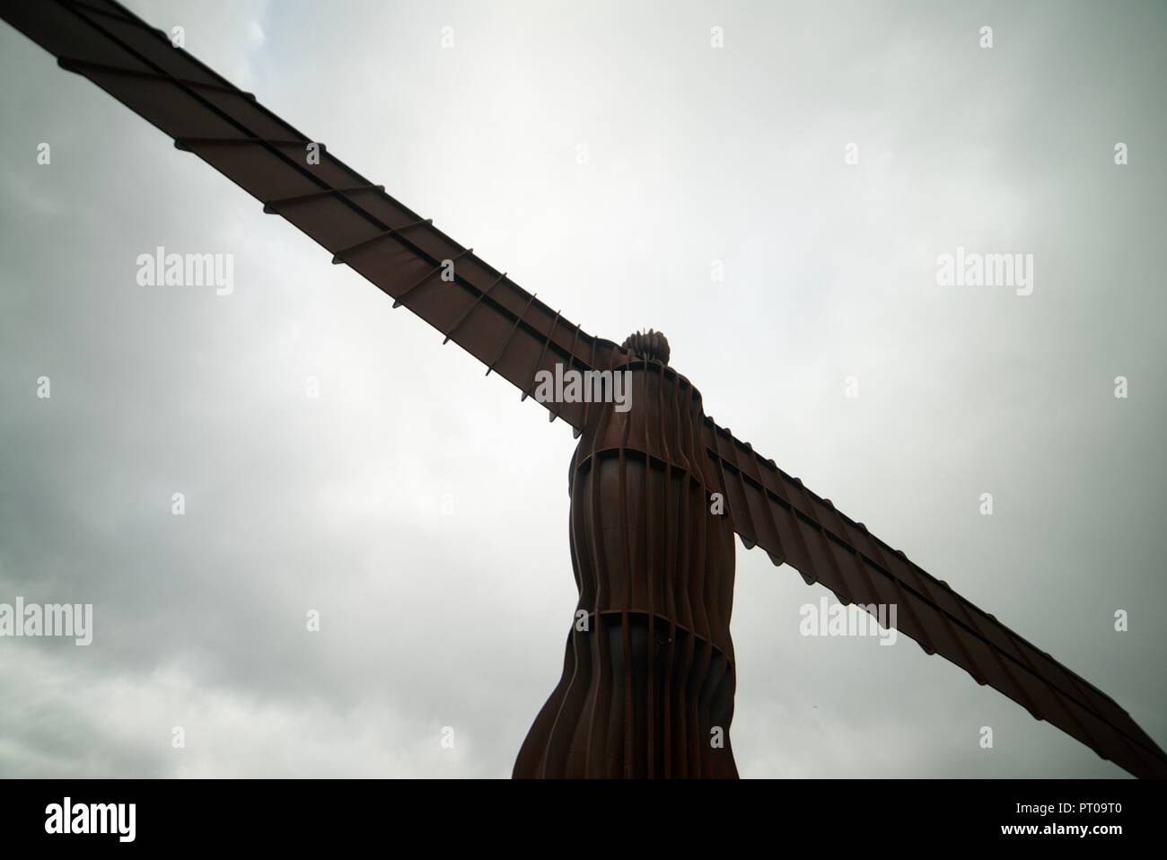 The view looking up at the Angel of the North statue/sculpture in Tyneside, near Newcastle. The famous landmark in England. Stock Photo