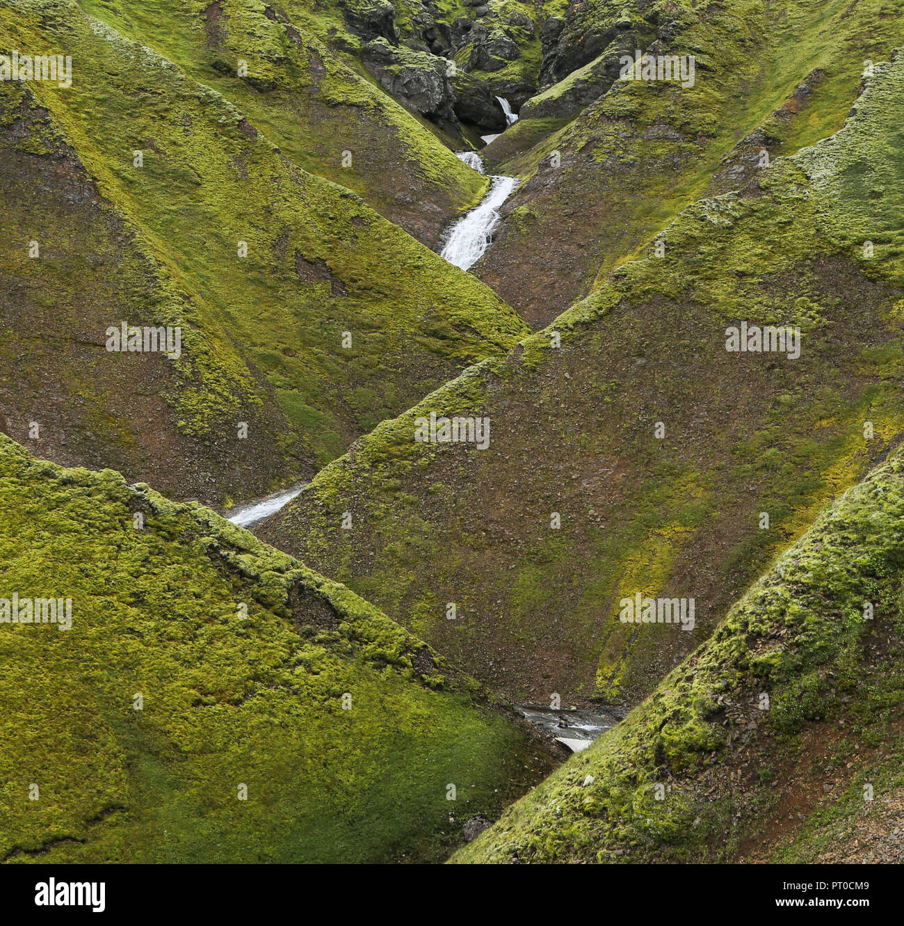 Brook flowing in zig-zag through the old lava Stock Photo