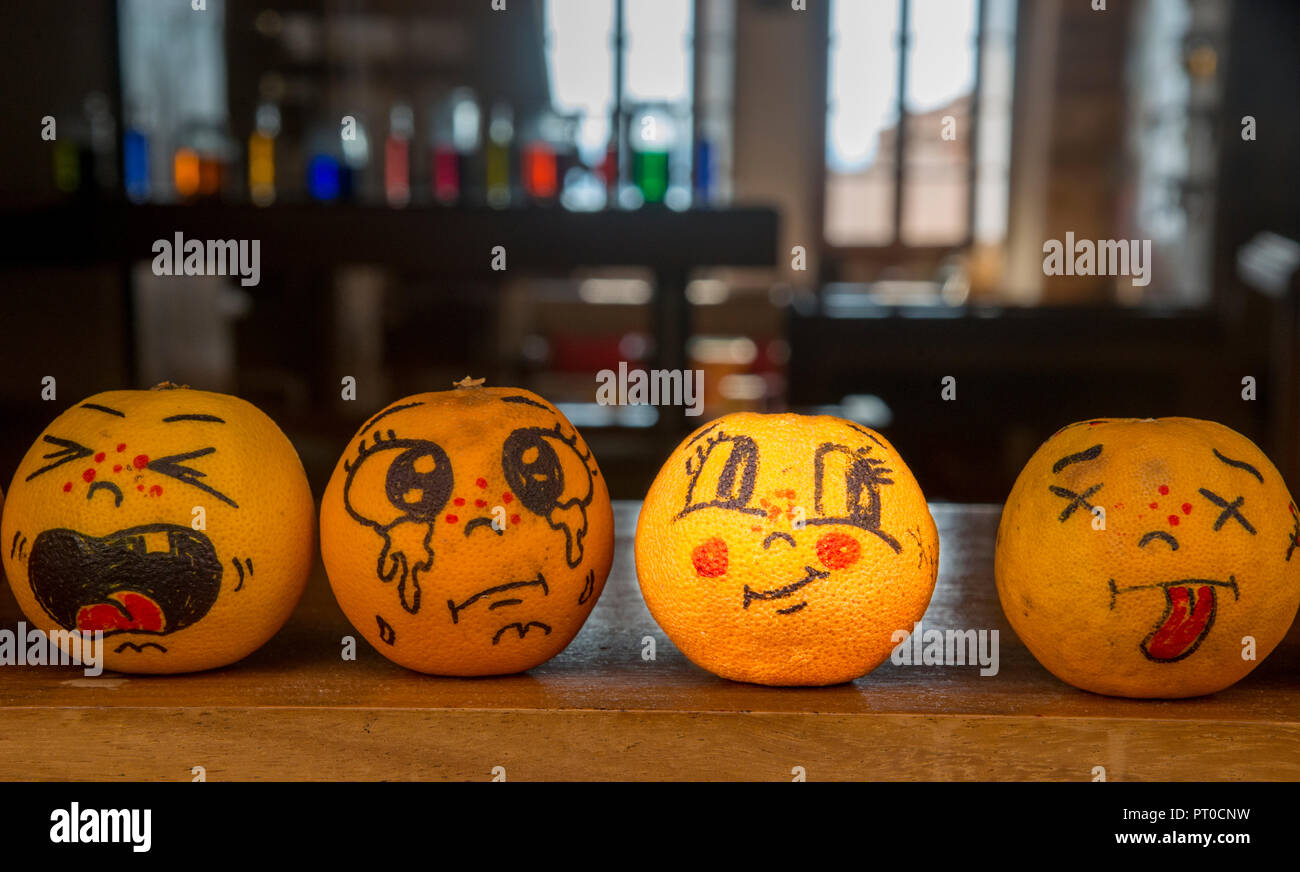 Oranges with painted feelings Stock Photo