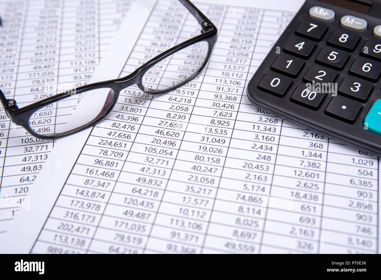 calculator and glasses on financial chart, business concept Stock Photo Alamy