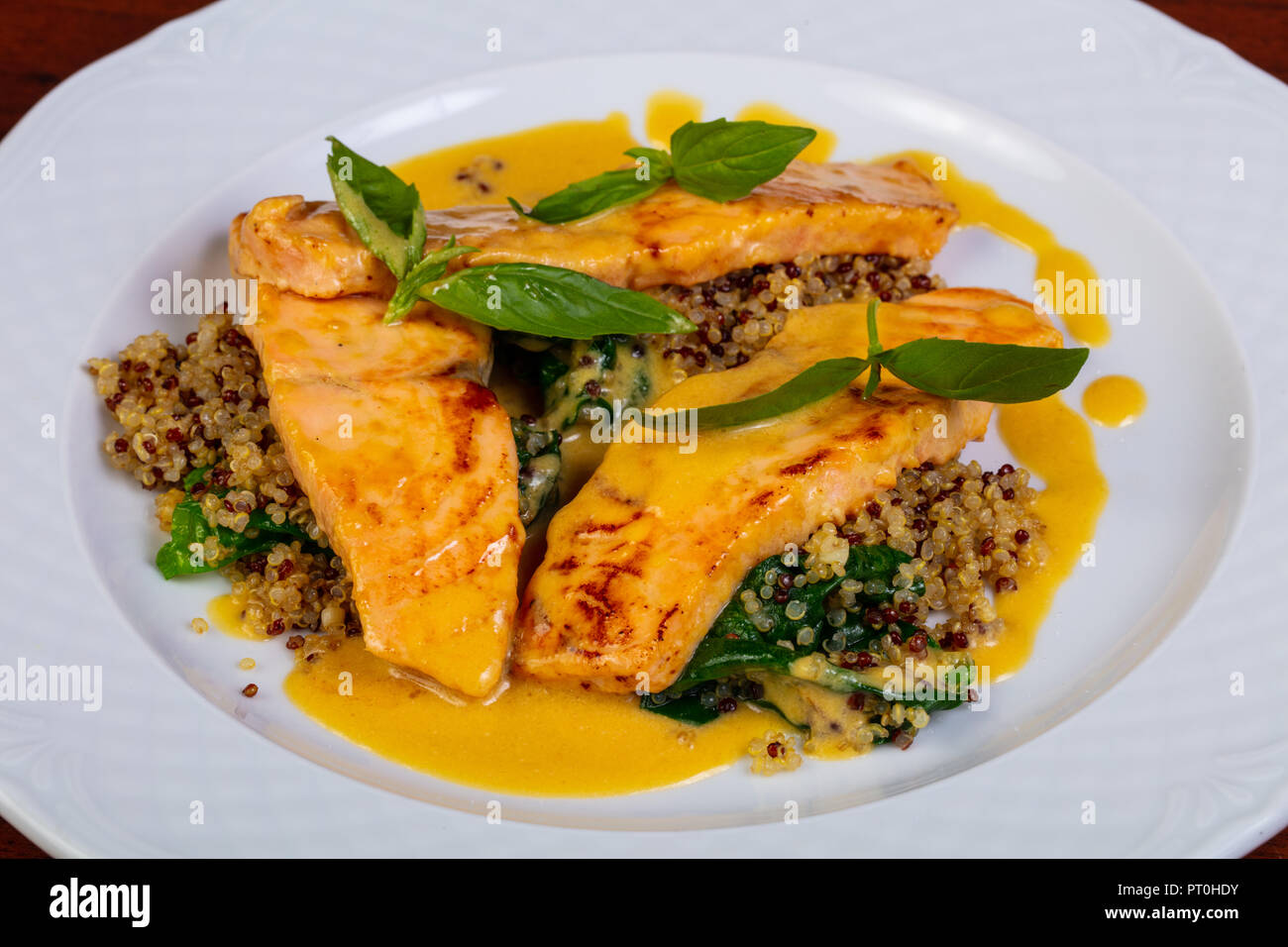 Grilled salmon steak with sauce Stock Photo - Alamy