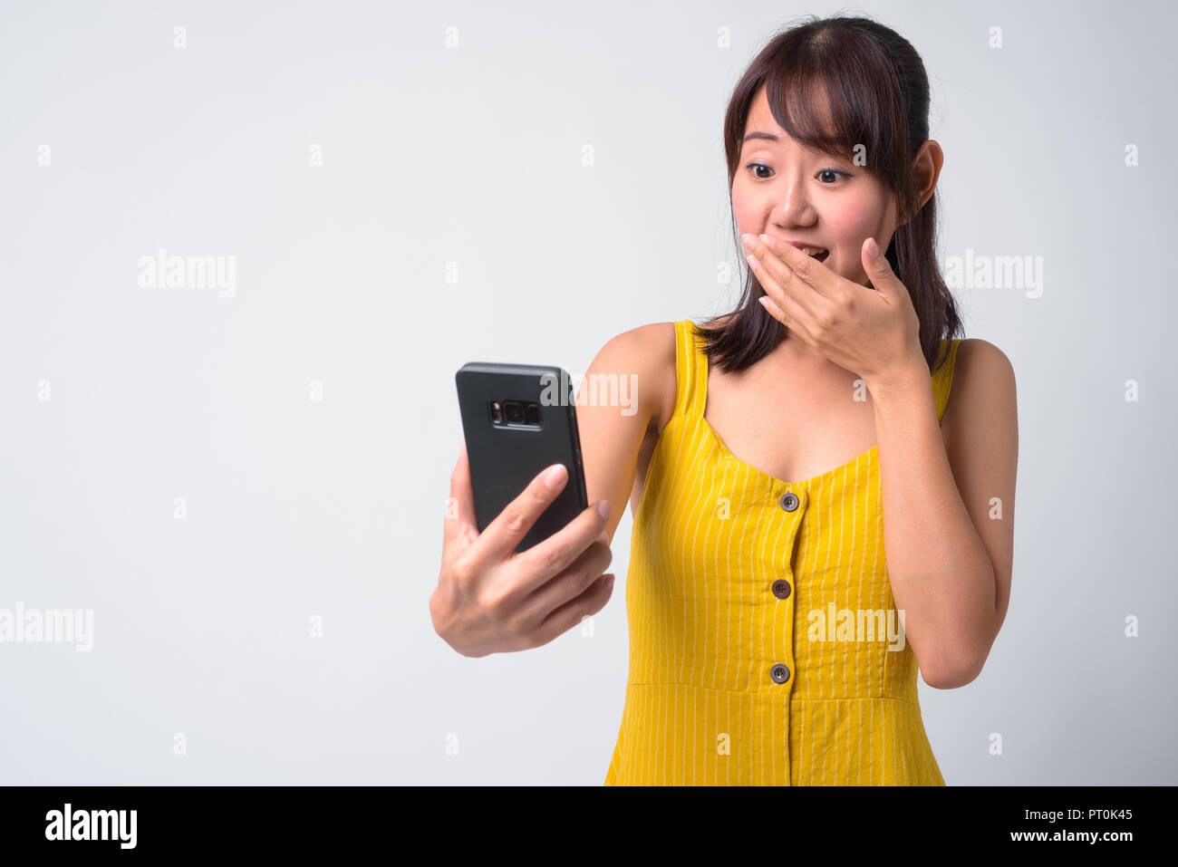 Portrait of beautiful Asian woman wearing yellow dress Stock Photo - Alamy