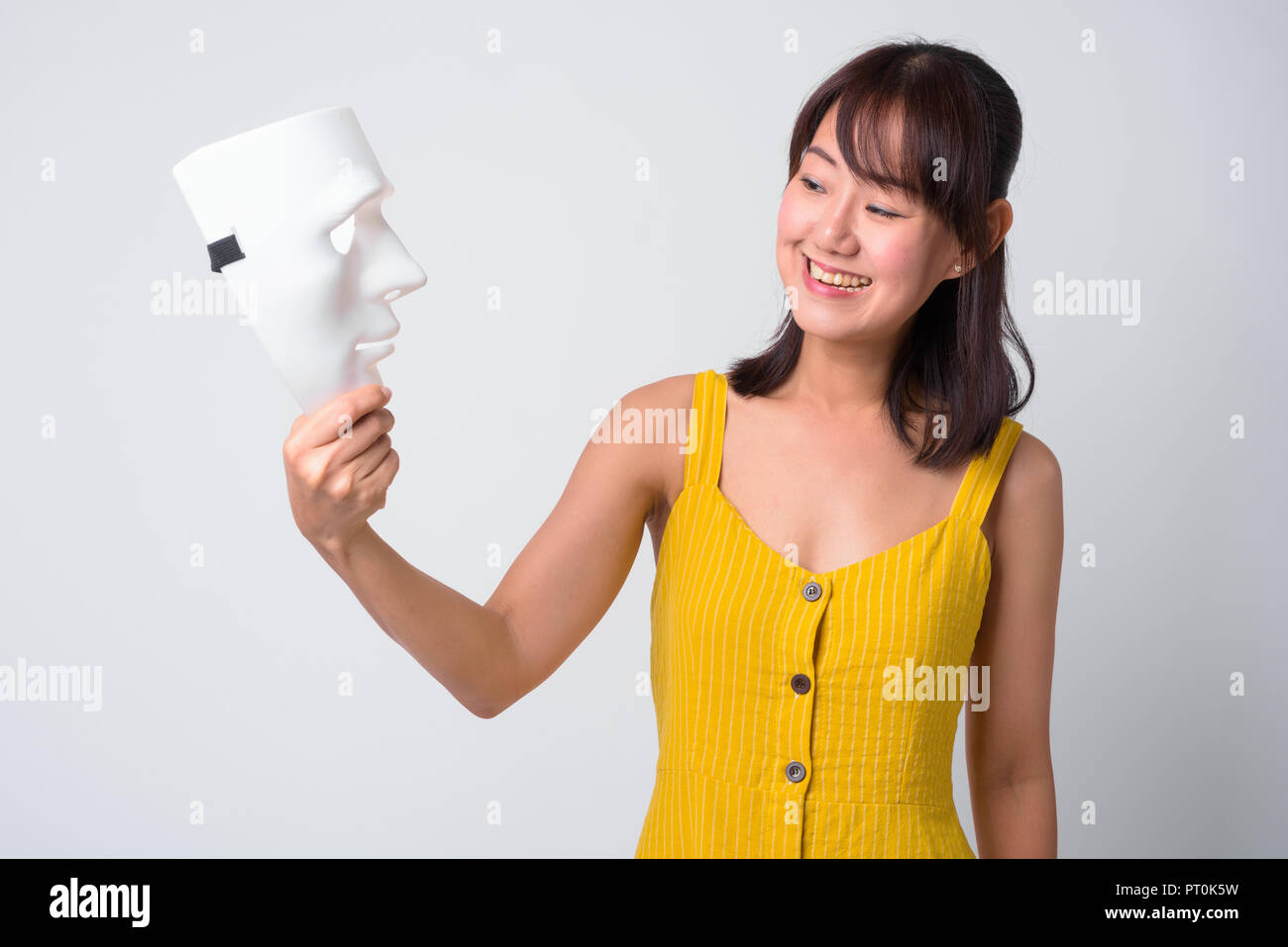 Portrait of beautiful Asian woman wearing yellow dress Stock Photo - Alamy