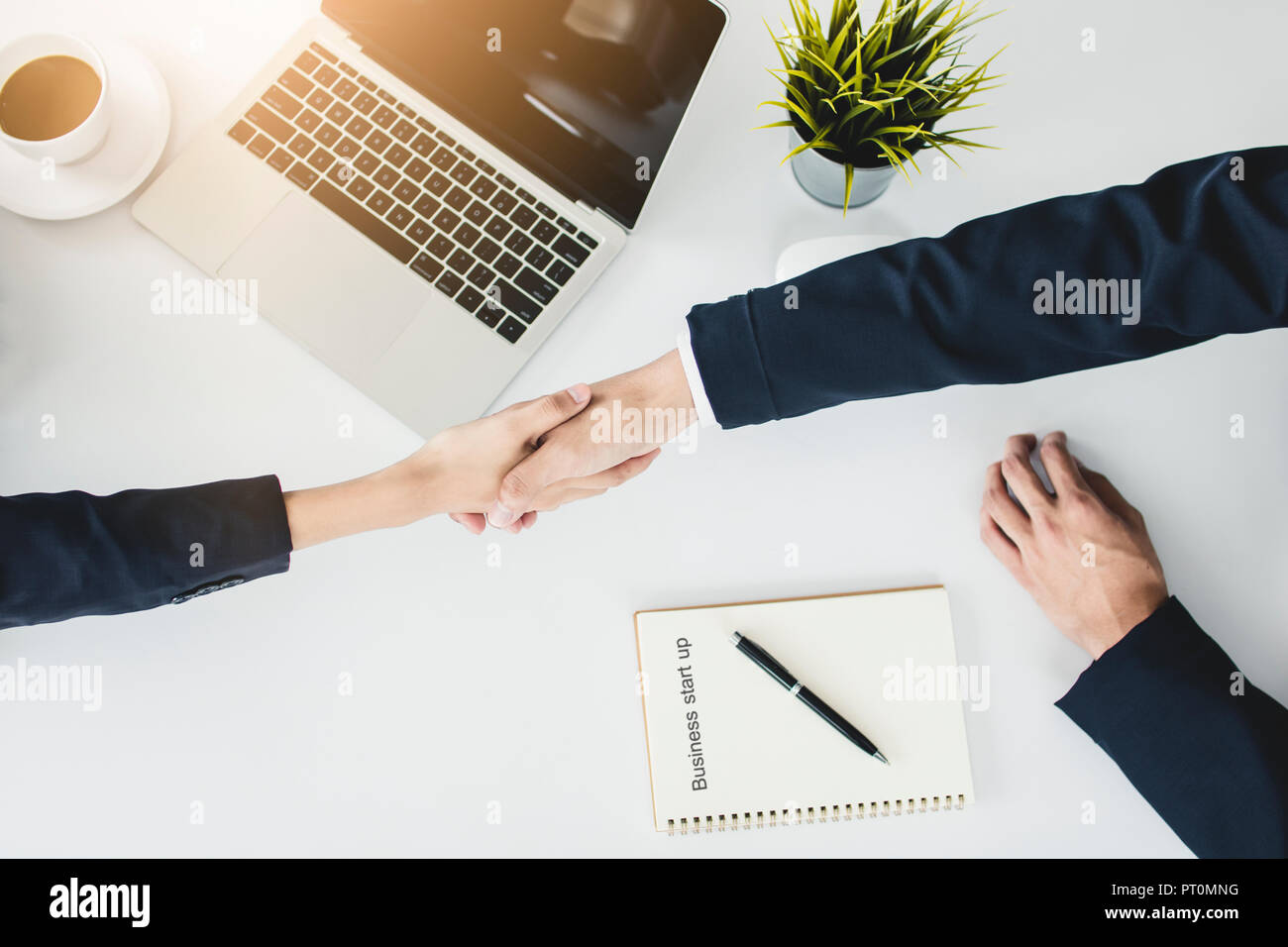 start up business people shake hands with investor before negotiating and planning to invest company together in office Stock Photo