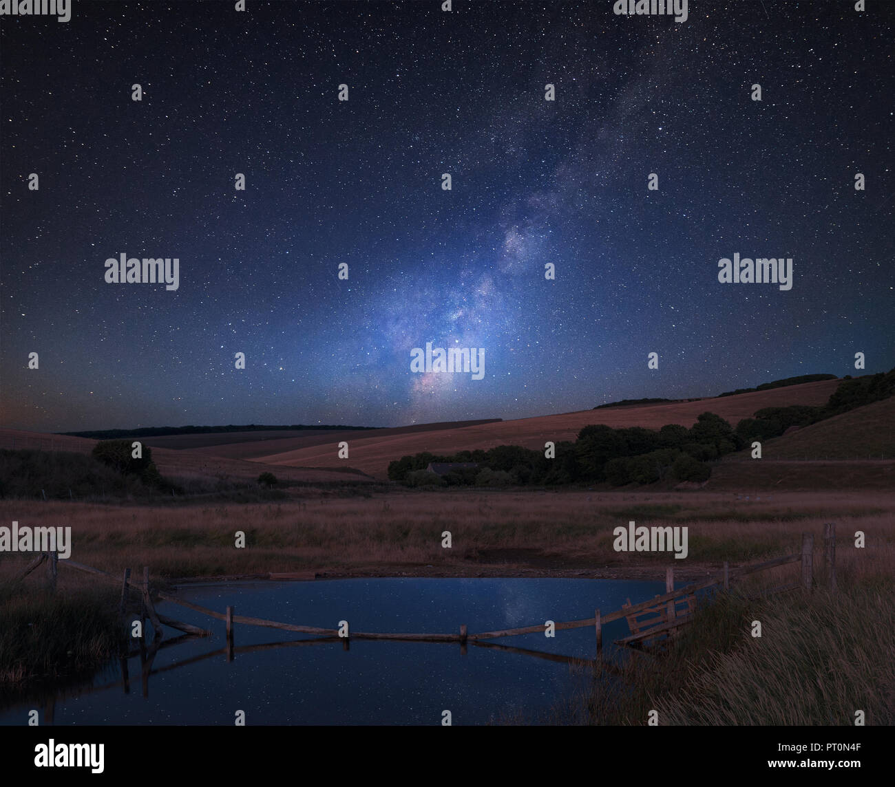 Stunning vibrant Milky Way composite image over landscape of English ...