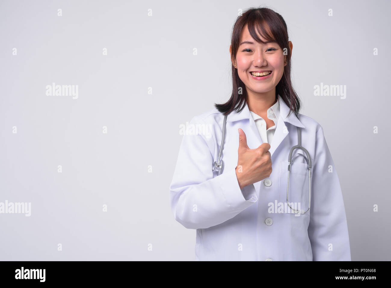 Portrait of beautiful Asian woman doctor against white background Stock ...