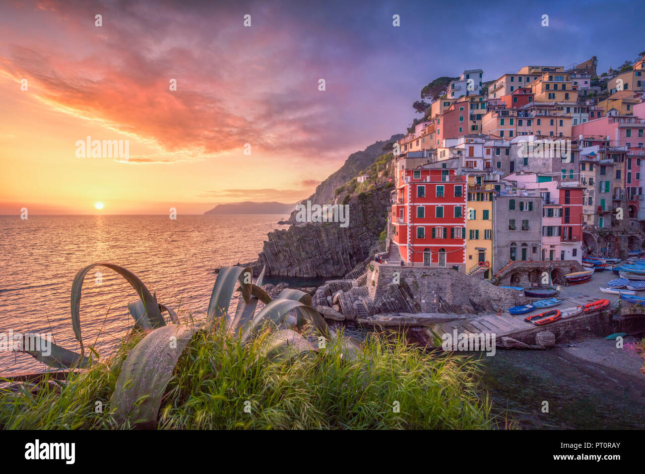 Italy, Liguria, La Spezia, Cinque Terre National Park, Riomaggiore at sunset Stock Photo