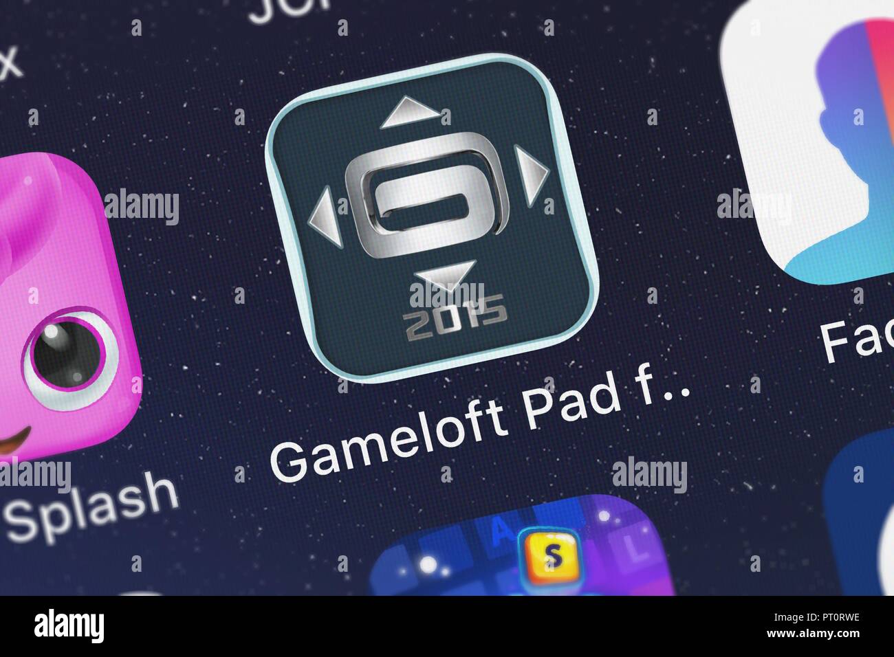 London, United Kingdom - October 05, 2018: Close-up of the Gameloft Pad for Samsung Smart TV (2015) icon from Gameloft on an iPhone. Stock Photo