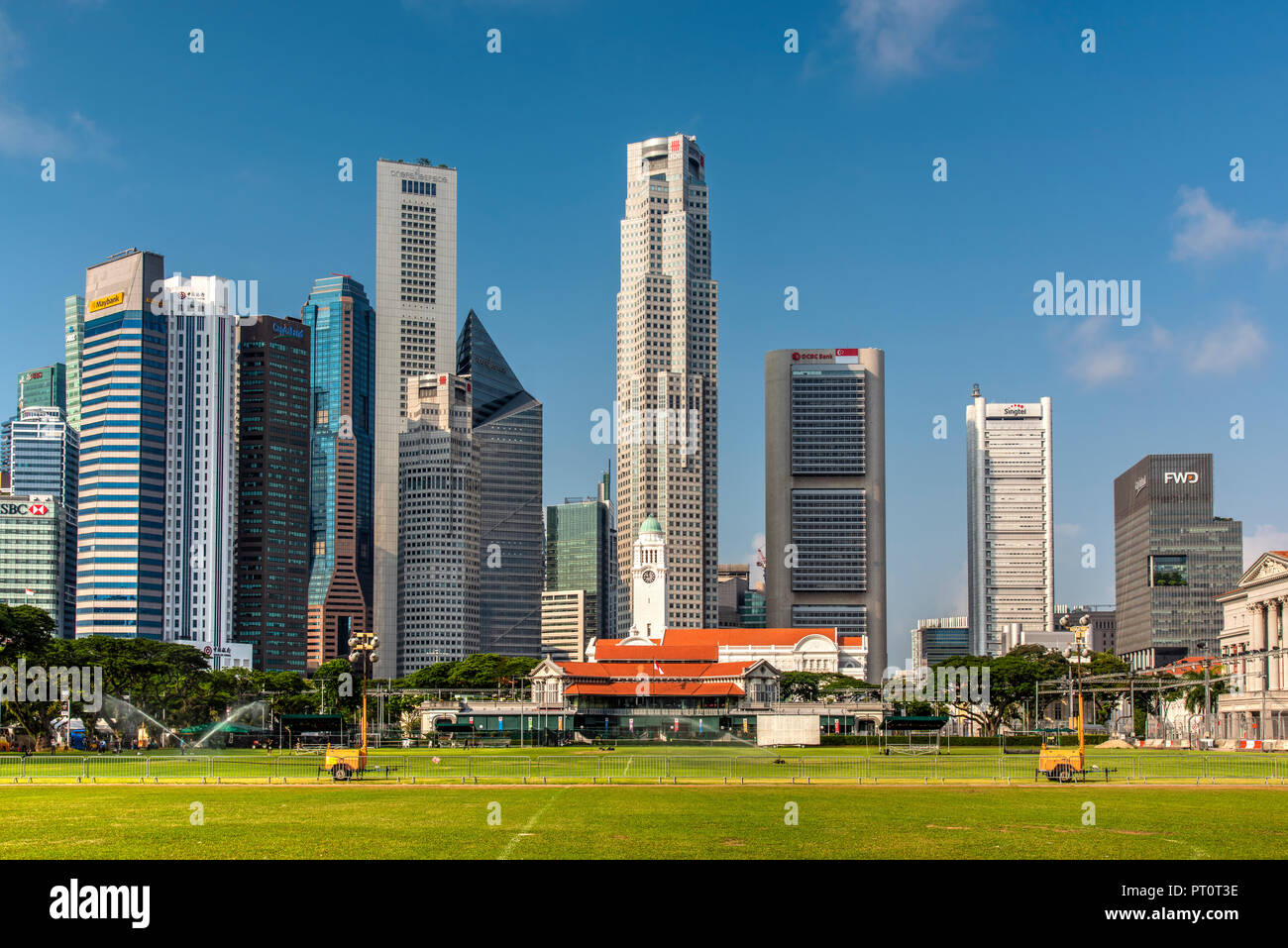 Padang field and financial district skyline, Singapore Stock Photo