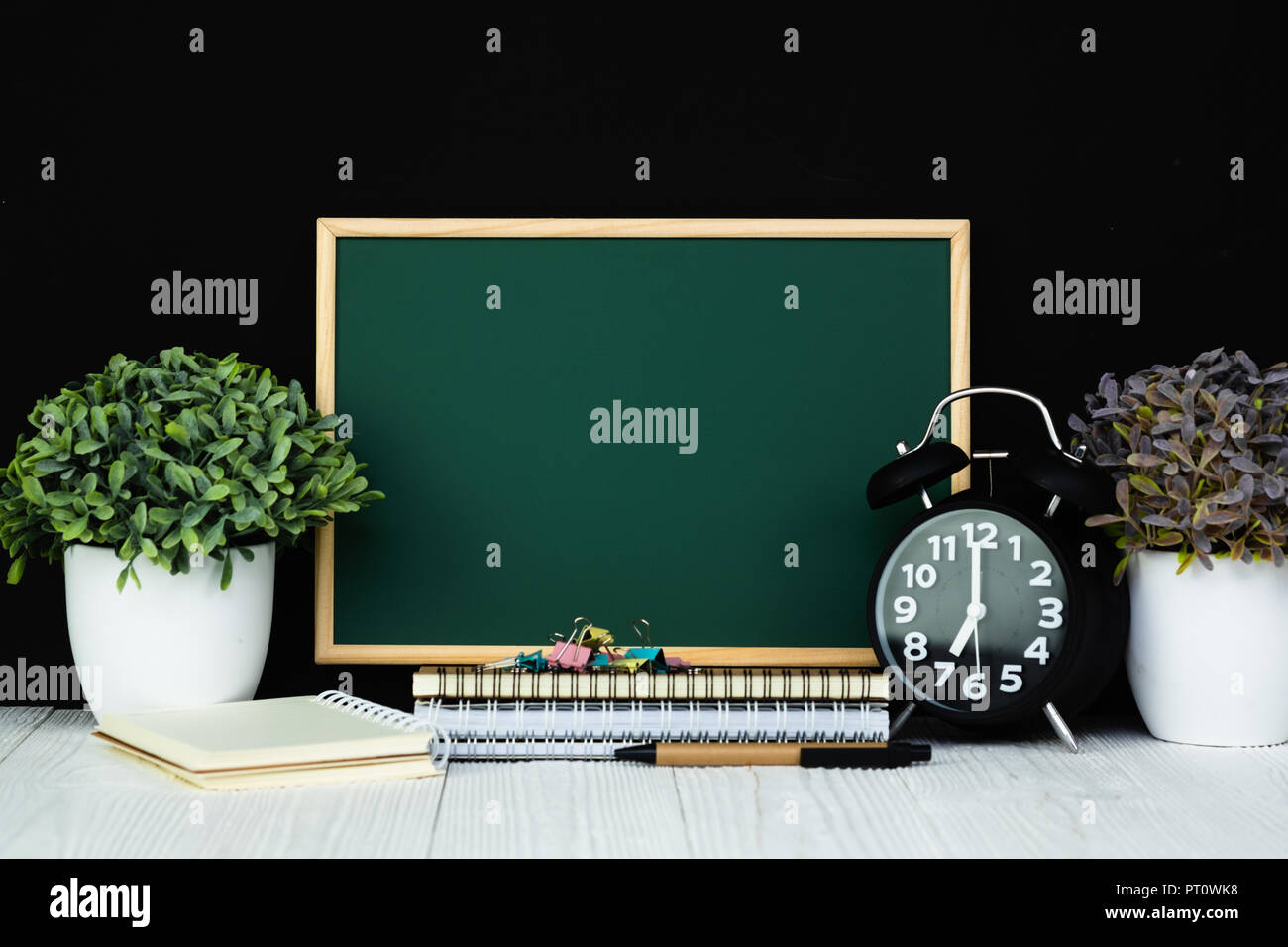 Back to school and education concept idea, green chalkboard with pile ...