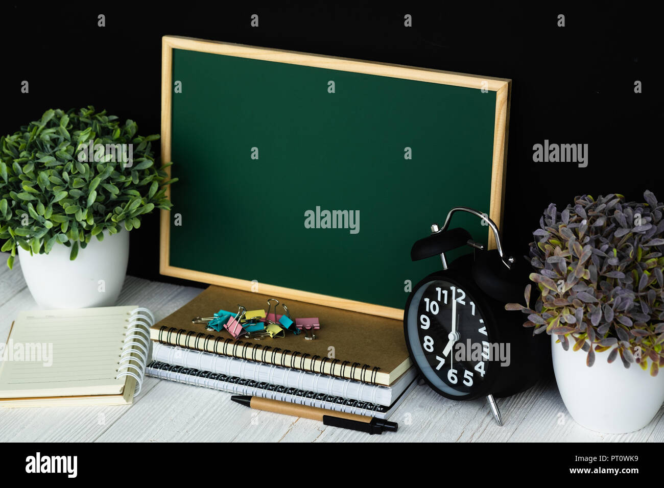 Back to school and education concept idea, green chalkboard with pile ...
