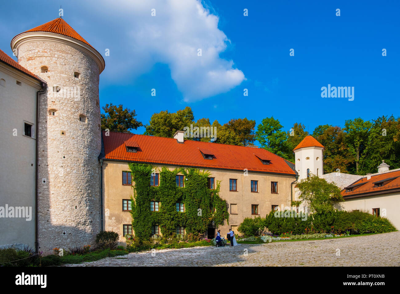 Pieskowa Skala, Lesser Poland / Poland - 2018/09/09: Inner courtyard and gothic tower of historic castle Pieskowa Skala by the Pradnik river in the Oj Stock Photo