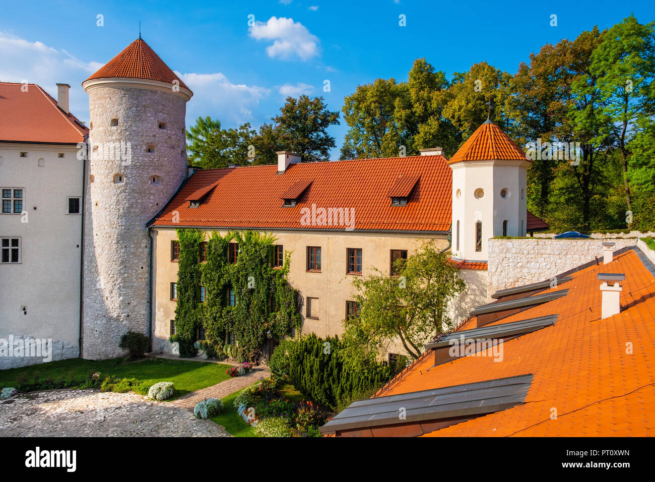 Pieskowa Skala, Lesser Poland / Poland - 2018/09/09: Inner courtyard and gothic tower of historic castle Pieskowa Skala by the Pradnik river in the Oj Stock Photo