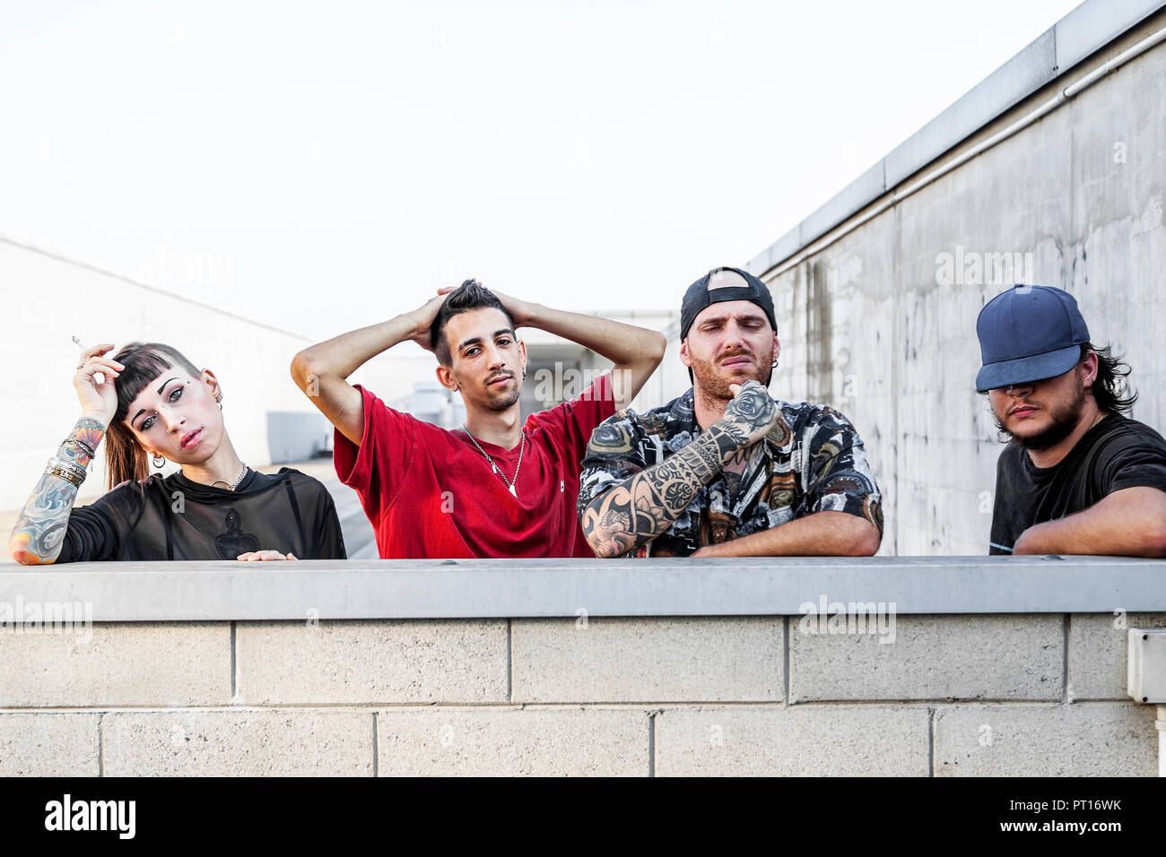Young rapper leaning against wall hi-res stock photography and images ...