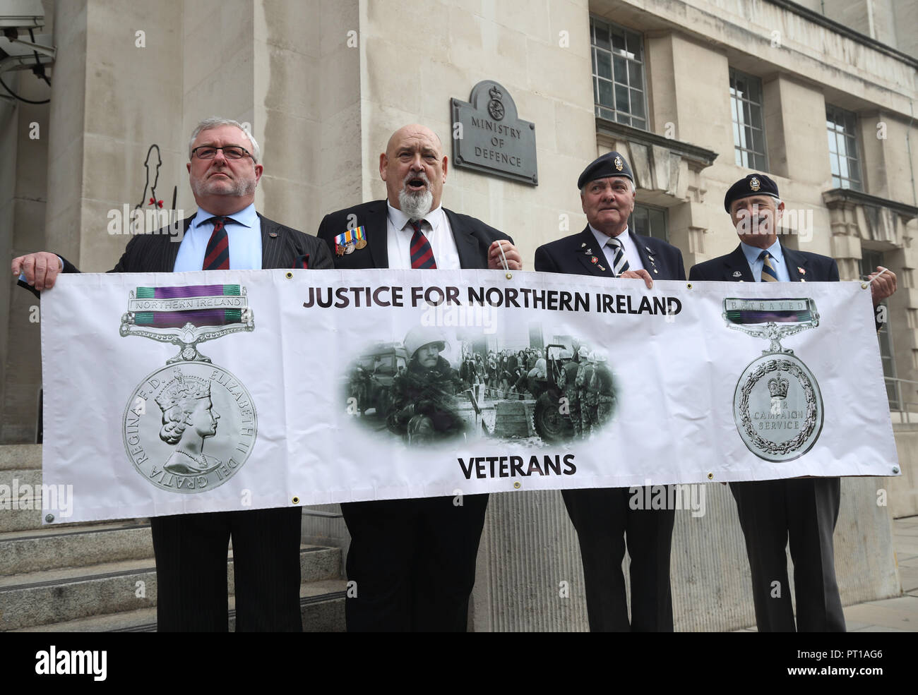 Veterans (left to right) Alan Barry, Roy Brinkley, Michael Burke and Peter White protesting outside the Ministry of Defence in Whitehall, London, against investigations into troops who fought in during the Troubles in Northern Ireland. Stock Photo