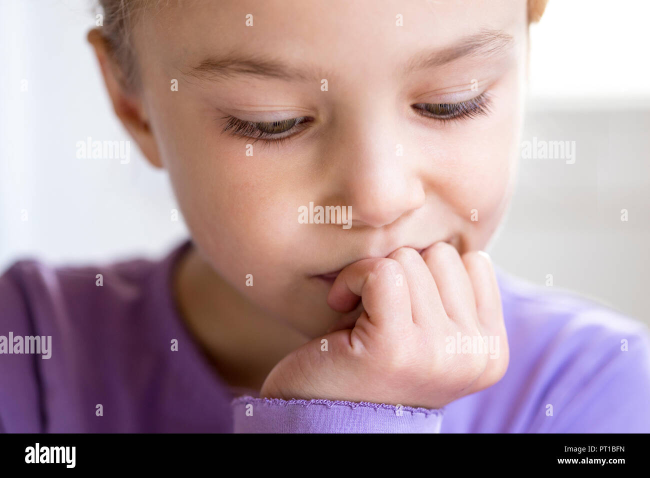 Portrait of pensive little girl, close-up Stock Photo