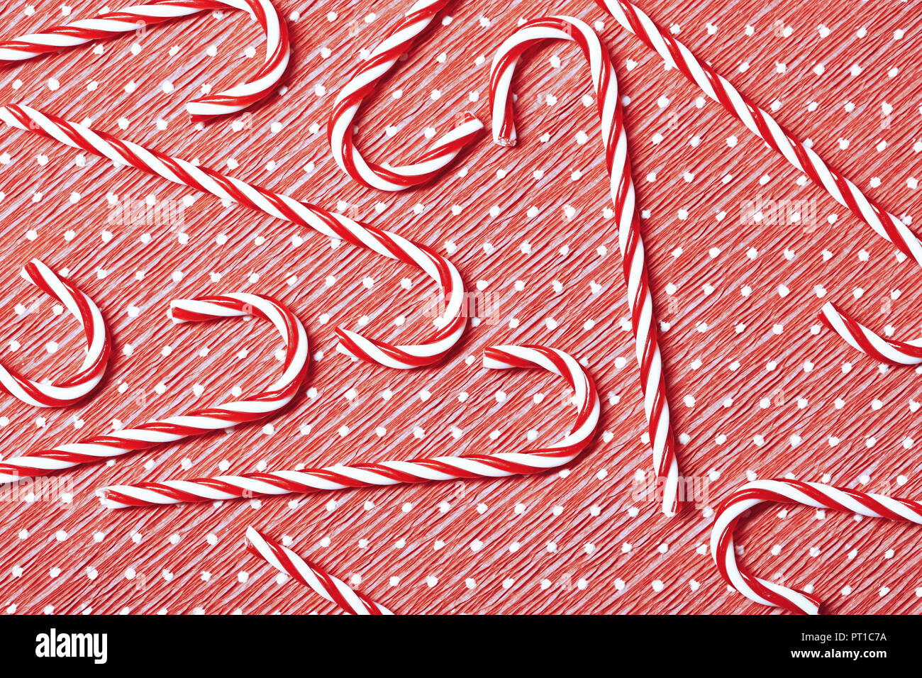 Candy canes on wrapping paper Stock Photo Alamy