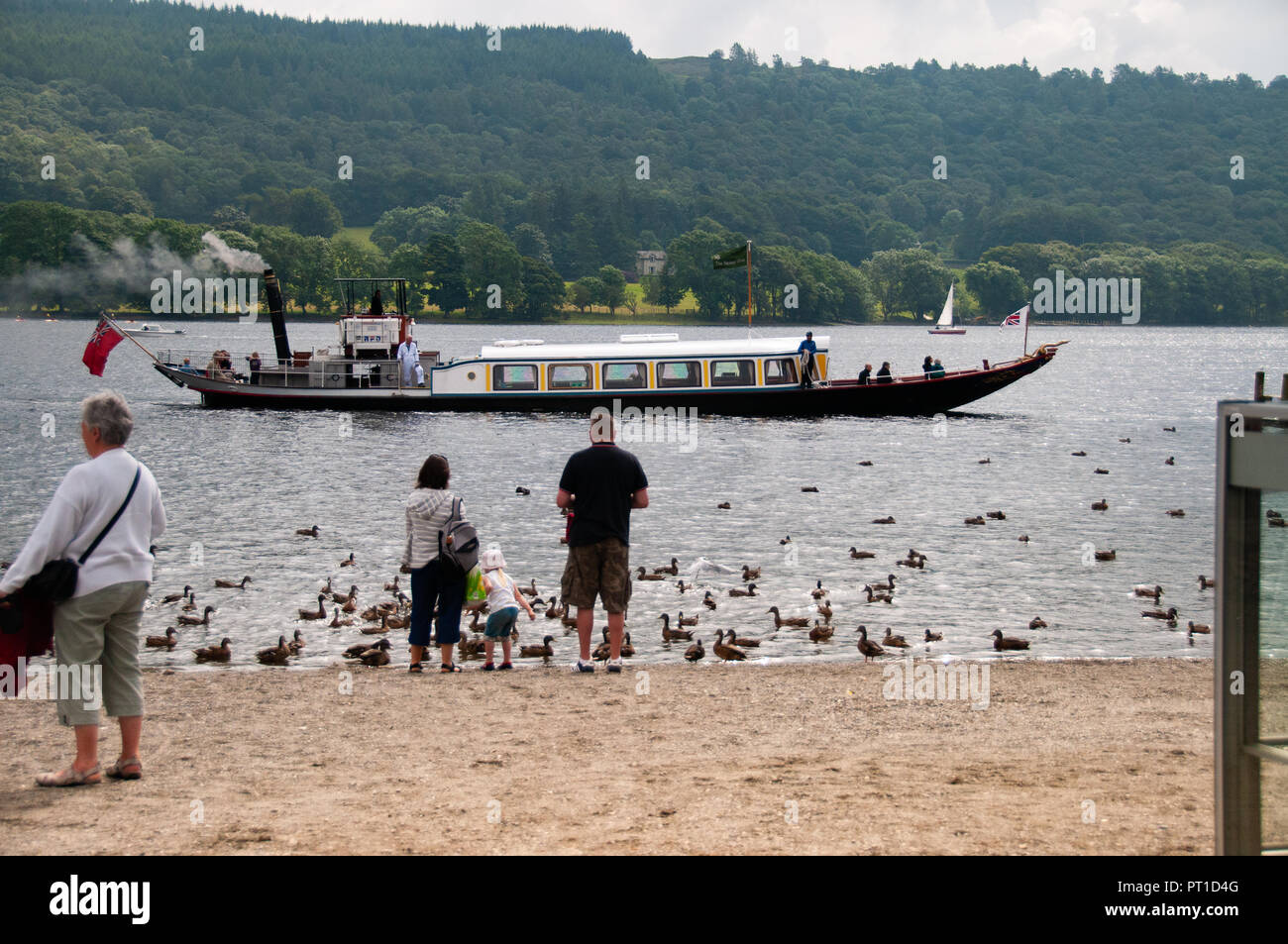 Historic, vintage, Steam yacht gondola sailing down Coniston Water on a