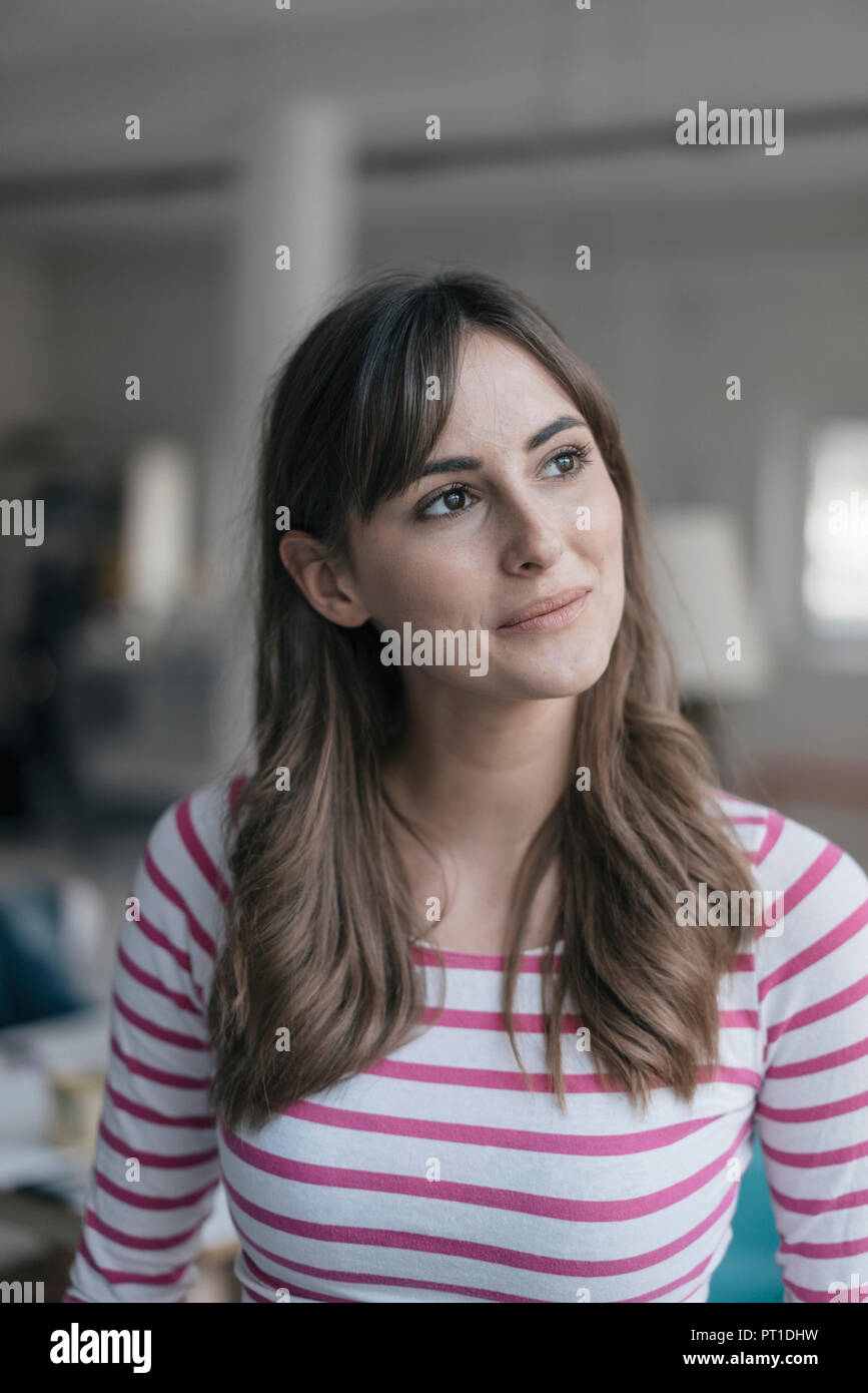 Portrait of a smiling, confident young woman Stock Photo