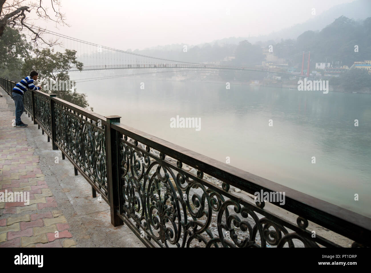 Beautiful view of Ganga river embankment in Rishikesh. Indian tourist enjoys beautiful views of the Ganges river. Rishikesh India, January 10, 2018 Stock Photo