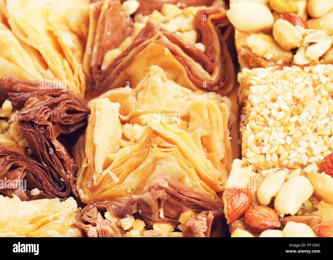 different oriental sweets baklava on wooden table Stock Photo