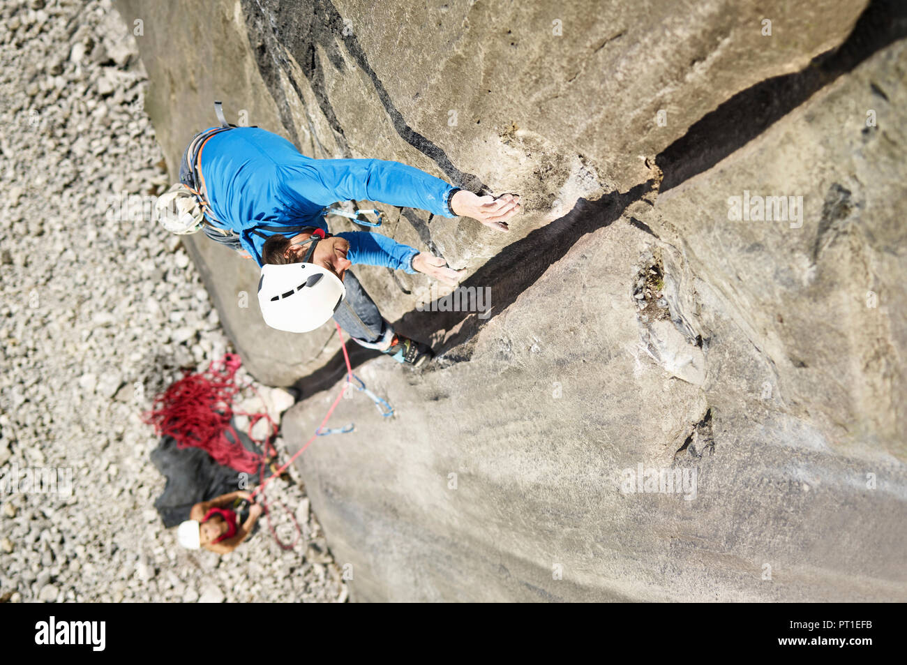 Austria, Innsbruck, Martinswand, man climbing in rock wall Stock Photo